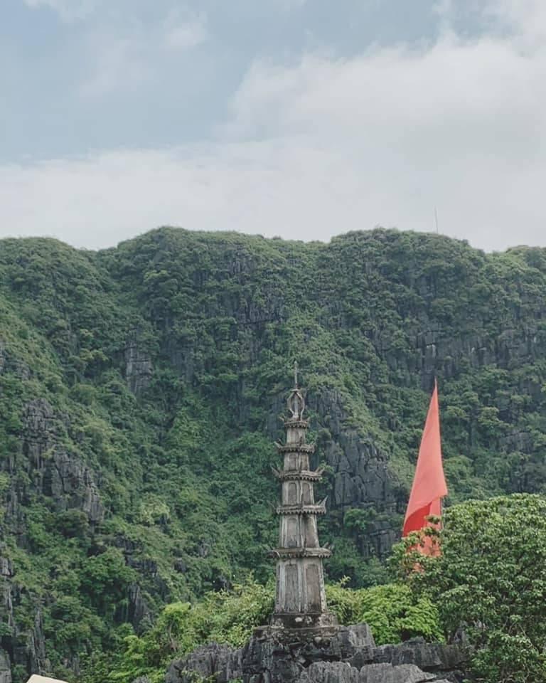 view of a tower with mountain background